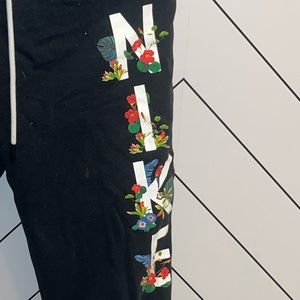 Black nike sweatpants with floral details, size small, online exclusive,